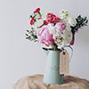 Flower Arrangement in Teal Vase