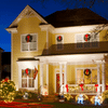 Exterior of two storey yellow farm house with Christmas lights and other decorations
