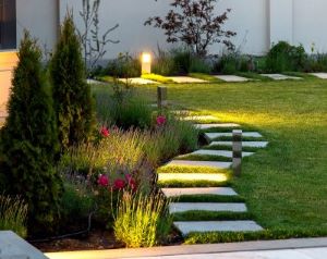 Entryway Envy CROPPED WEB Paver path with flowers and lights