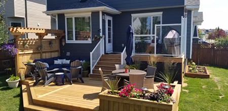 Pressure Treated deck with Flower box and Faux rock Busy Beaver Construction