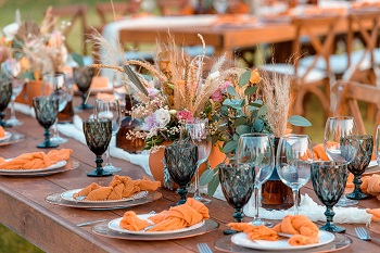 Table setting with orange napkin