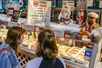 2 girls looking at bakery food