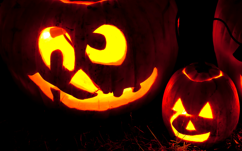 carved jack o lantern with silly face and lopsided eyes