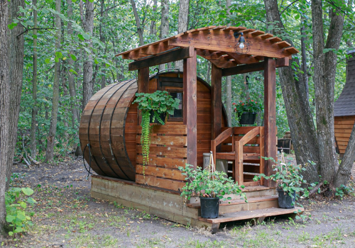 Custom wooden barrel sauna in woods