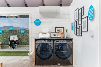 Laundry room with washing and drying machines