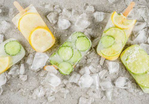 clear popsicles with lemon or lime inside on pile of ice
