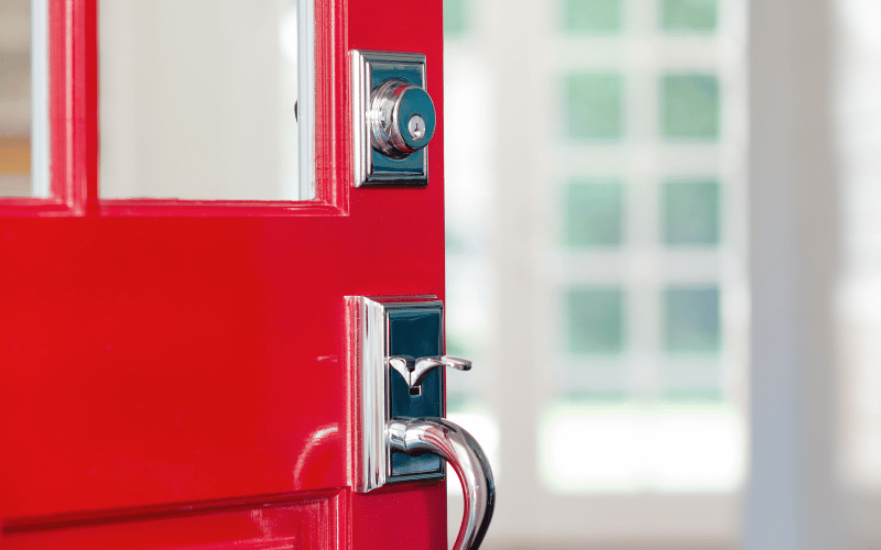 bright red front door opening into blurry white interior
