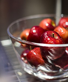 apples in a glass bowl apples in a glass bowl