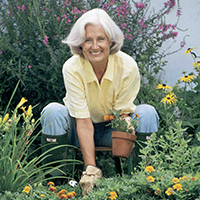 Senior Day lady gardening in backyard