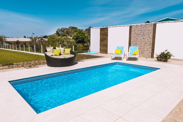 swimming pool with lounge chairs