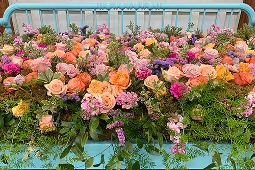 An arrangement of abundant peach roses at the Indiana Flower + Patio Show