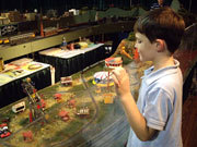 tiny trains Child looking at train set